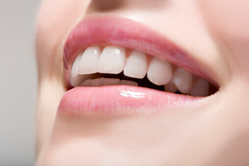 Closeup-Smile-Looking-Up-Gray-Background-1.jpg