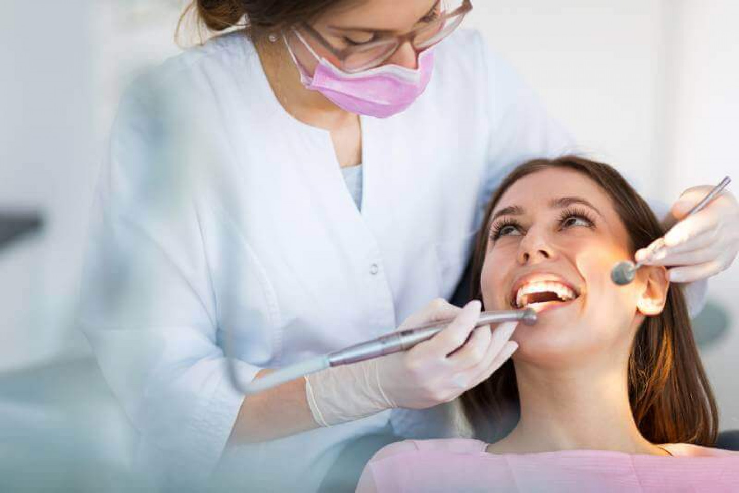 compressed-35-Caucasian-Female-Dental-Exam-Smiling-Dentist-Brunette.jpeg